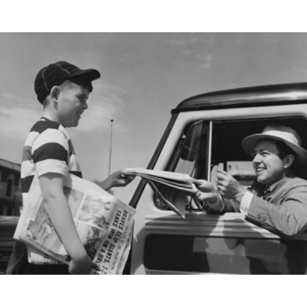 Young man buying a newspaper from a paper delivery boy Poster Print (18