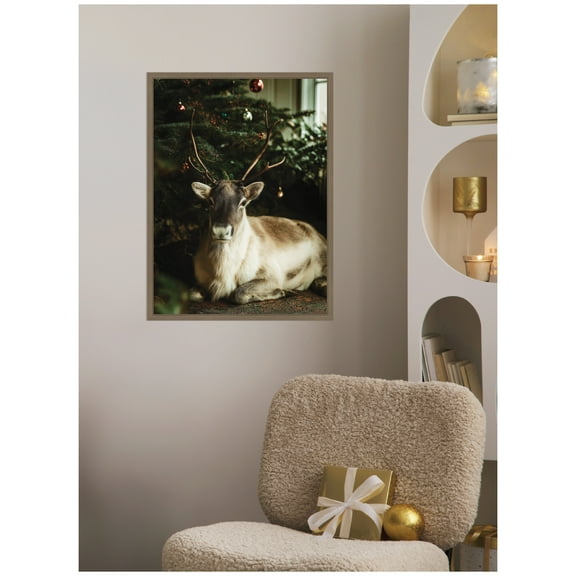 Kate and Laurel Framed Canvas Wall Art Print 'Reindeer Sitting Under a Christmas Tree' by Michael Schauer, 18 x 24 Sylvie Dark Gold Frame, Rustic Farmhouse, Animal Art for Wall Decor