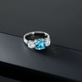 thumbnail image 4 of Gem Stone King 3.74 Cttw Swiss Blue Topaz and White Moissanite 3 Stone Engagement Ring for Women | 925 Silver | Gemstone Birthstone | Cushion 8MM | Three Stone Wedding Anniversary Ring | Size 6, 4 of 6