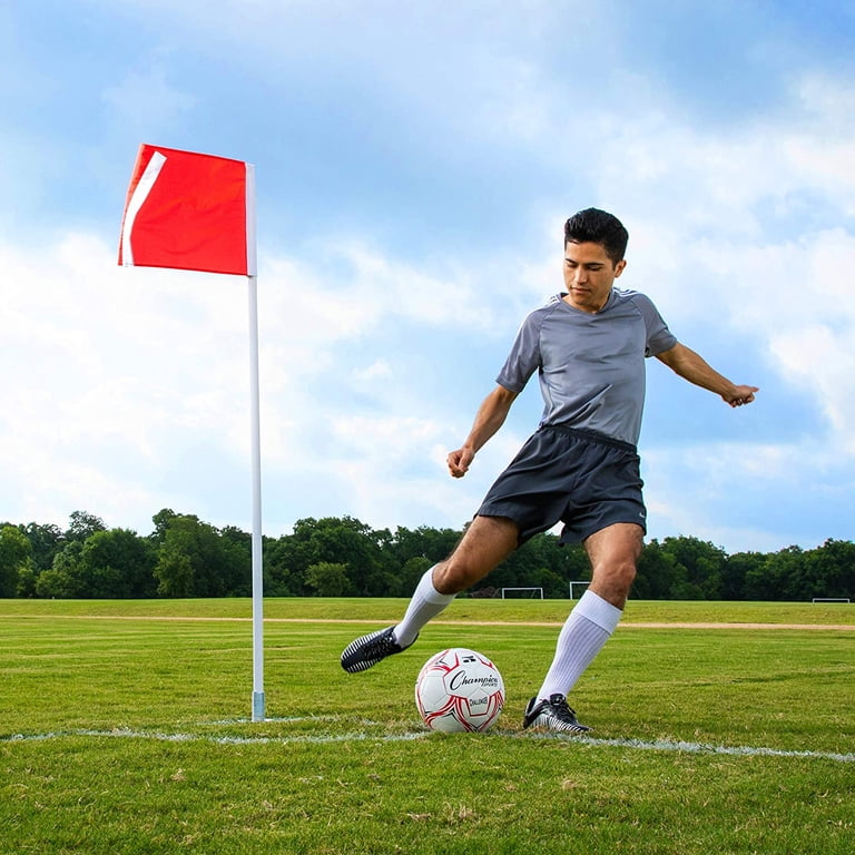 Corner Flag Of A Soccer Field With People Playing Out Of Focus Stock