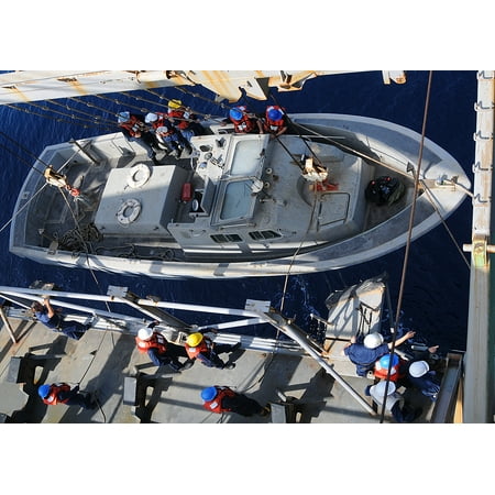 - LAMINATED POSTER Deck department Sailors prepare to lower a landing craft personnel large during a small boat recover Poster Print 24 x 36