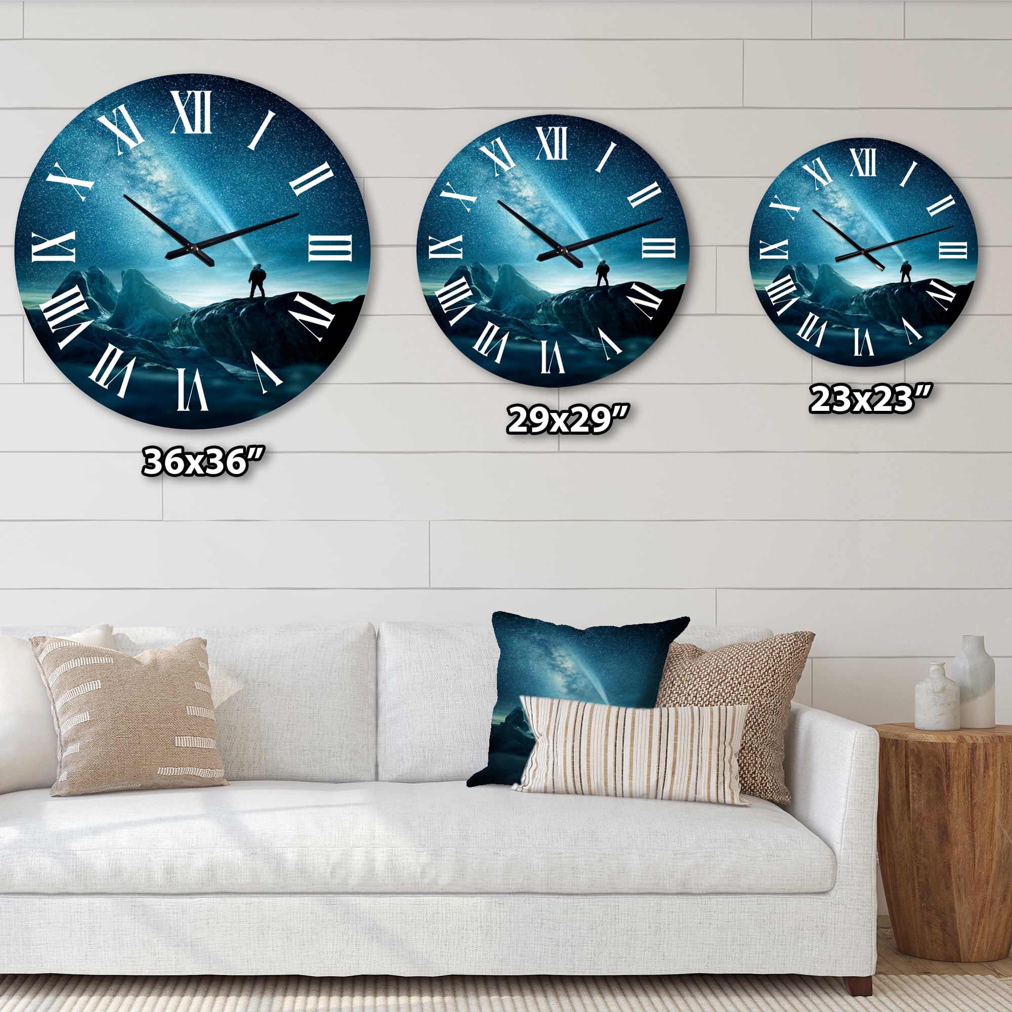 Designart 'A Man Shining A Light Into The Night Sky' Modern Wall Clock