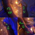 thumbnail image 2 of 12 hojas de tatuajes temporales navideños para niños, tatuajes temporales navideños que brillan en la oscuridad para niños, bolsas de regalo navideñas con decoraciones para fiestas de cumpleaños,, 2 of 5
