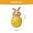 thumbnail image 2 of El Conejo de Pascua se sienta en la cáscara del huevo y no escucha, mira ni habla sobre la decoración de la mesa. MFZFUKR BST3012460-1, 2 of 5