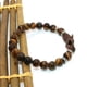 thumbnail image 5 of EeaseMX 1 pulsera de cuentas de ojo de tigre de moda, cuerda elástica, joyería decorativa, cuerda de muñeca unisex, accesorio para disfraz con decoración de dragón (colores surtidos)., 5 of 8