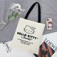 thumbnail image 1 of Sanrio-Bolso de hombro de Hello Kitty para mujer, bandolera informal de gran capacidad, con letras de lona, a la moda, Harajuku, con cremallera, 1 of 4