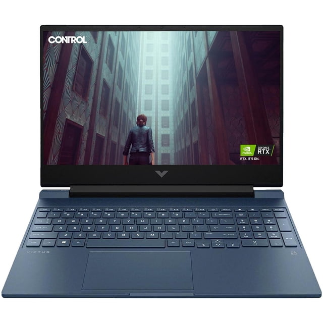laptop gamer hp victus geforce rtx 3050 intel core i5 13420h ram 16gb 512gb ssd 15.6" windows 11 home teclado en ingles — Vista frontal centrada de la HP Victus abierta, pantalla 15.6" FHD mostrando un juego, teclado en inglés de tamaño completo con pad numérico, touchpad centrado y bisel superior con cámara; chasis azul oscuro con acabado mate visible. Pantalla 144 Hz y NVIDIA GeForce RTX 3050 según especificaciones; a menudo se usa también para edición y streaming.