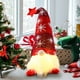 thumbnail image 1 of Adorno navideño de anciano sin rostro con sombrero de estrella iluminado | Muñeco colgante con patas para árbol y chimenea | Colores rojo, gris y verde, 1 of 5