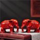 thumbnail image 1 of A pair of red solid wood carved elephant figurines, auspicious symbols for home decor, used to fill in missing corners in the living room, and as decorative crafts., 1 of 4