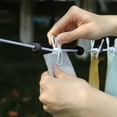 thumbnail image 4 of RuiJiao 70.87in Retractable Portable Clothesline for Travel, Clothing line with 12 Clothes Clips, for Indoor Laundry Drying line,Outdoor Camping Accessories, 4 of 6