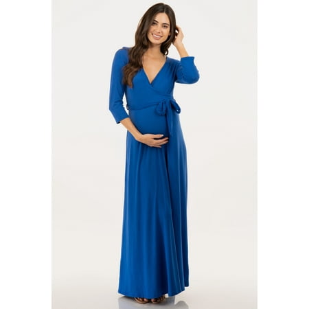 an expecting mom wearing a blue maternity dress