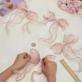 thumbnail image 3 of 4 abrazaderas para cortinas con forma de mariposa y perlas, diseño Misty Rose con lazo y perlas., 3 of 9