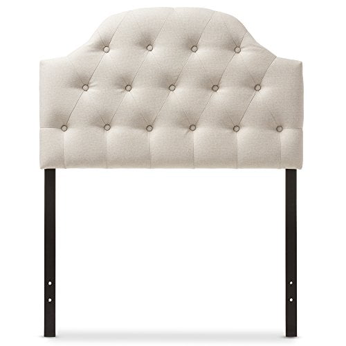 Baxton Studio Maugier Modern and Contemporary Light Beige Fabric Upholstered Button Tufted Scalloped Headboard, Twin. This bedroom furniture piece features a curved scalloped design with button tufting, upholstered in durable light beige polyester fabric. Adjustable legs with pre-drilled holes allow for customizable height. Made from quality hardwood and plywood for stability and strength.