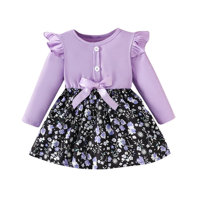 odeerbi niñas manga larga rib knit floral vestido primavera otoño bow princess vestidos ruffled cuello redondo a-line vestido morado — vista frontal centrada de vestido infantil con cuerpo de punto acanalado morado de manga larga y volantes en hombros; dos botones en el pecho y lazo satinado morado en la cintura; falda evasé negra con estampado floral morado y blanco hasta la rodilla sobre fondo blanco. Ideal como vestido casual para girar y jugar.