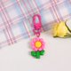 thumbnail image 1 of Llavero con tulipán de resina, colgante con forma de girasol y corazón para niña, bonito adorno para colgar en el bolso, adornos para auriculares, 1 of 6