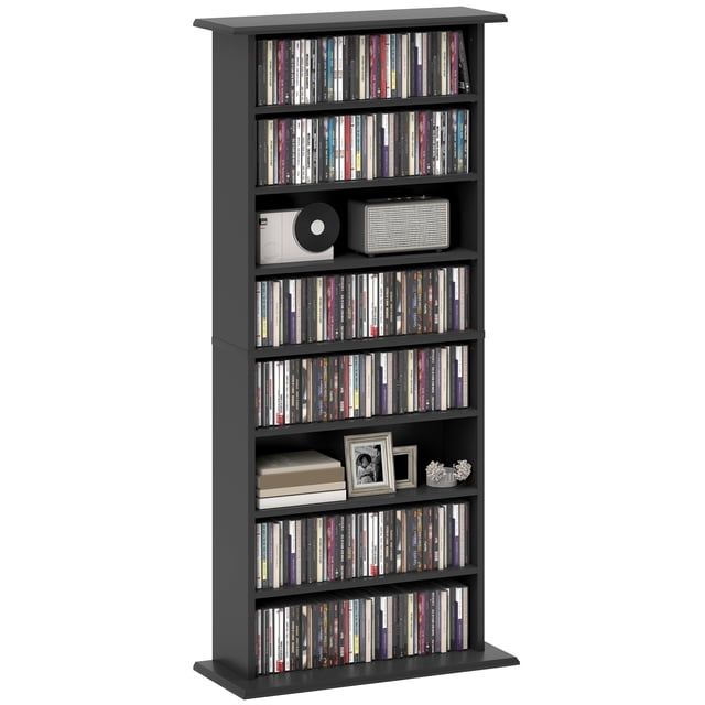 HOMCOM Armoire de Rangement Multimédia Étagère à DVD à 8 Niveaux avec Tablettes Ajustables en Noir. l'Armoire Présente 8 Compartiments avec 6 Tablettes Ajustables, Pouvant Contenir jusqu'à 360 CD, 185 DVD Ou 185 Blu-ray. Fabriquée en Panneau de Particules Robuste avec une surface en Mélamine, Elle Comprend une Sangle Anti-Basculement pour la Stabilité. la Conception Compacte Mesure 22,8 Pouces de Large, 9,4 Pouces de Profondeur et 49,7 Pouces de Hauteur, Ce Qui la Rend Idéale pour Organiser des collections Multimédias dans les Petits Espaces