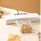 thumbnail image 1 of Máquina de envasado al vacío para alimentos, sellador al vacío con cortador integrado para alimentos húmedos y secos, incluye bolsas enrollables al vacío, 1 of 5