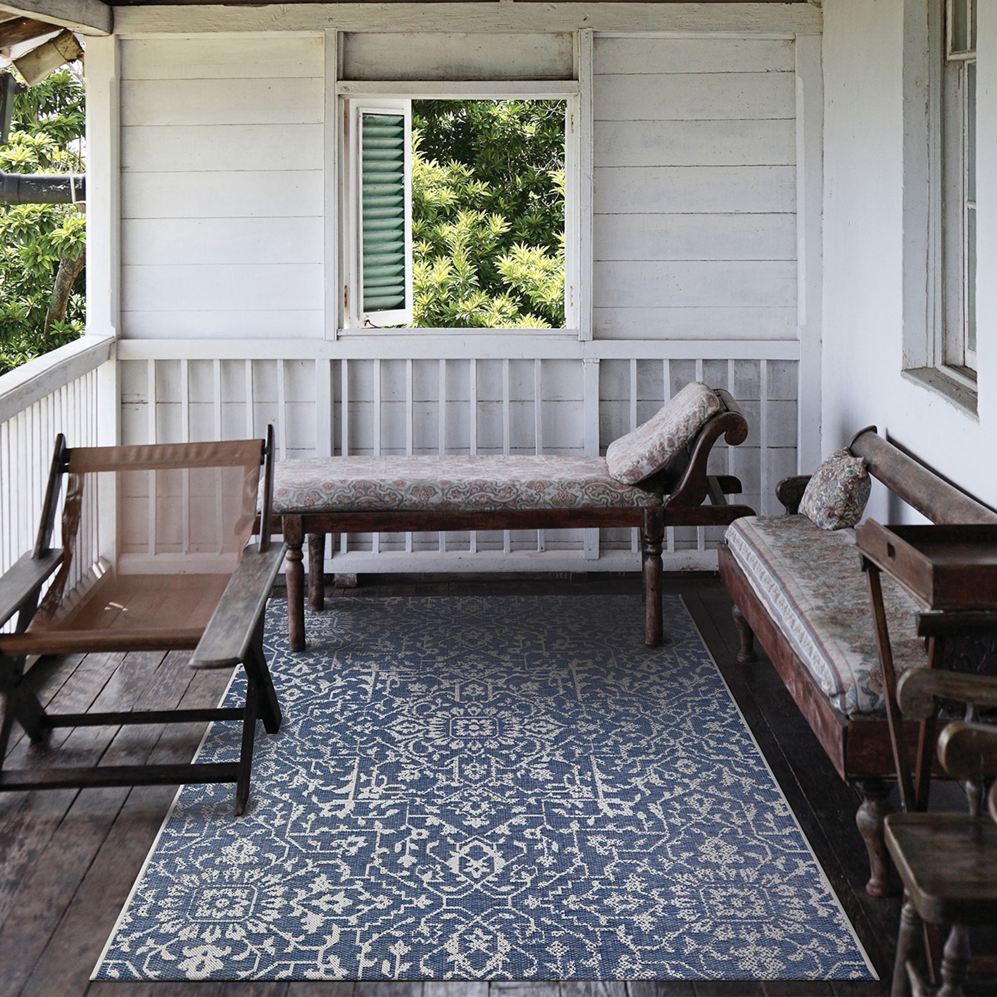 Couristan 5.5' x 9' Ocean Blue and Ivory Outdoor Floral Rectangular Area Throw Rug
