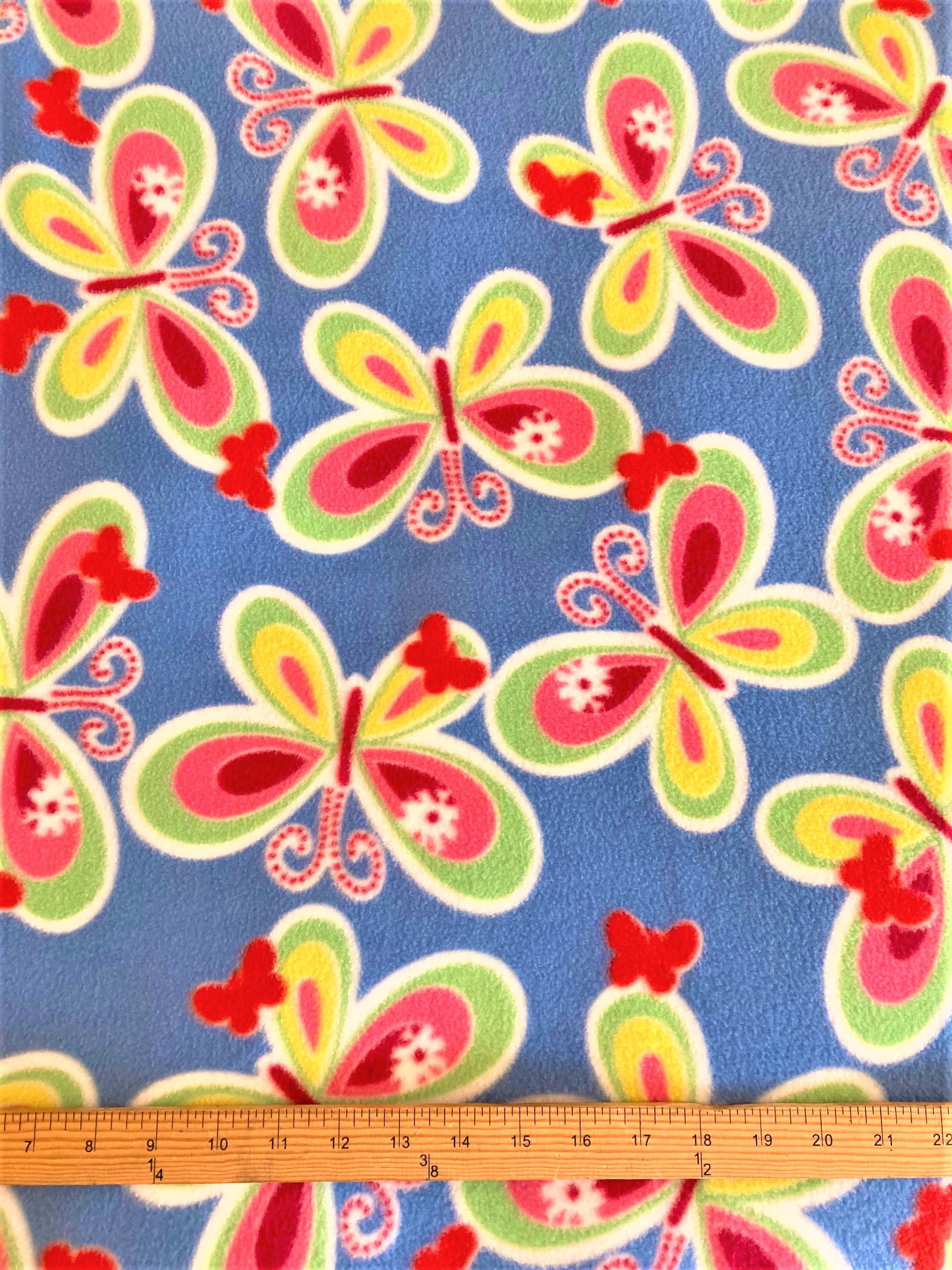 Lilly Craft Butterflies on Blue Fleece Print Fabric is 5860" Wide and