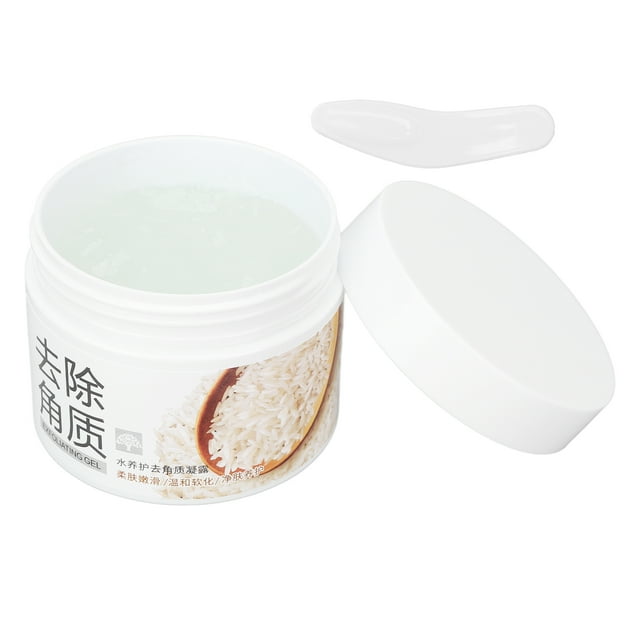 limpiador exfoliante , removedor hidratante facial, gel exfoliante para el cuidado de la piel de 4,9 oz para rostro para cuerpo. Tarro blanco abierto con gel exfoliante translúcido en su interior, tapa apartada y cucharilla de aplicación, etiqueta con imagen de arroz; según especificaciones elimina células muertas e hidrata, apto para uso en rostro y cuerpo y a menudo usado también para suavizar zonas rugosas como codos y talones.