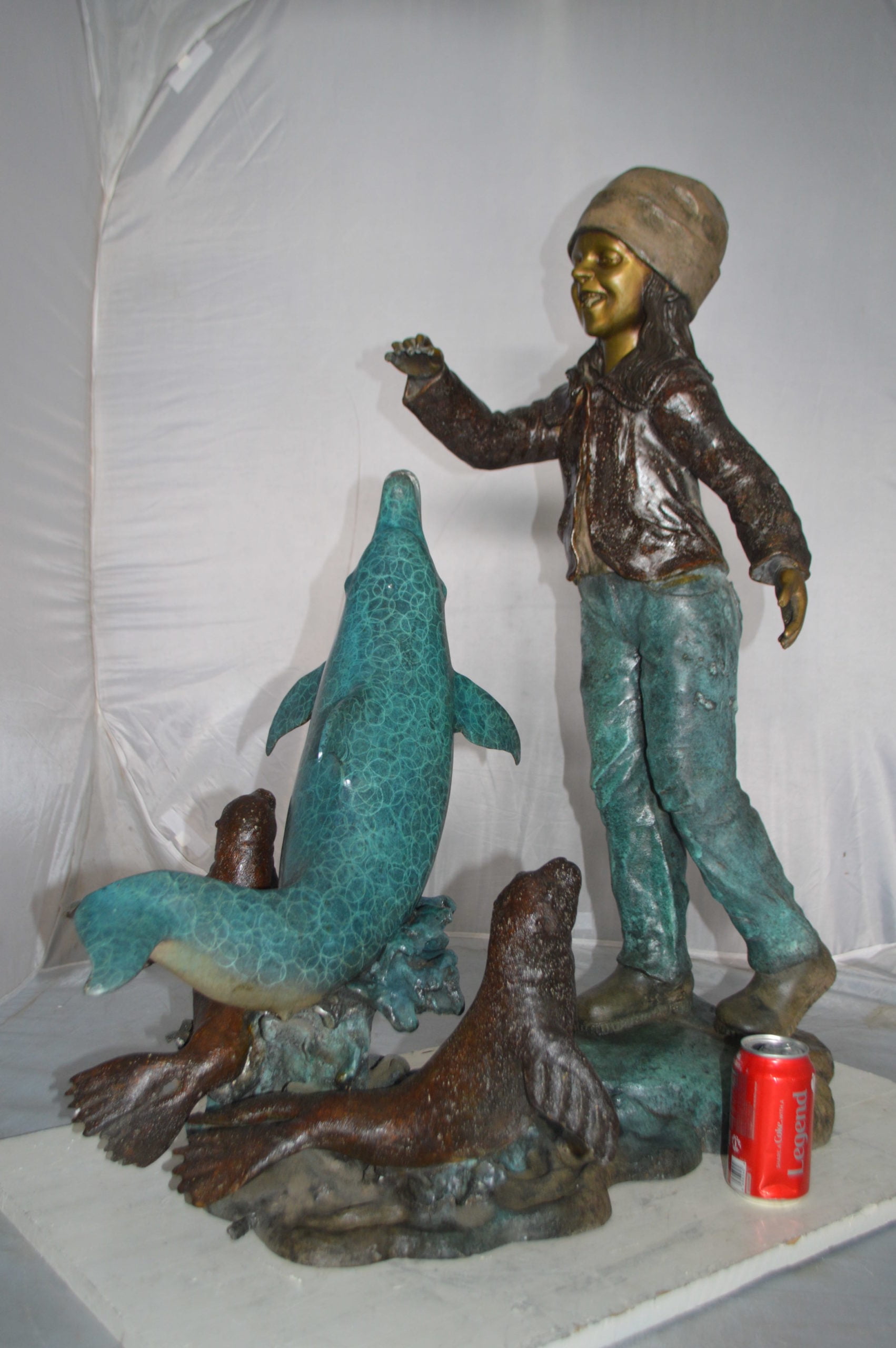Nifao Girl feeding a dolphin and seals – Outdoor Bronze Fountain, Garden Water Feature, 28"L x 17"W x 37"H