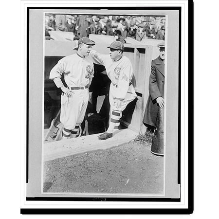 Historic Print [Clarence Pants Rowland manager of the Chicago White Sox (right) talks with his pitcher Eddie Cicotte (left) in the dugout during a game] 18 x 24