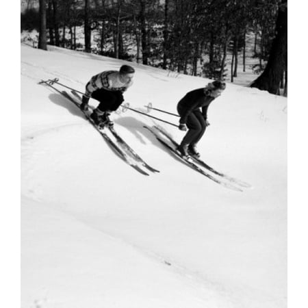 Low angle view of a young couple skiing downhill Canvas Art - (18 x 24)