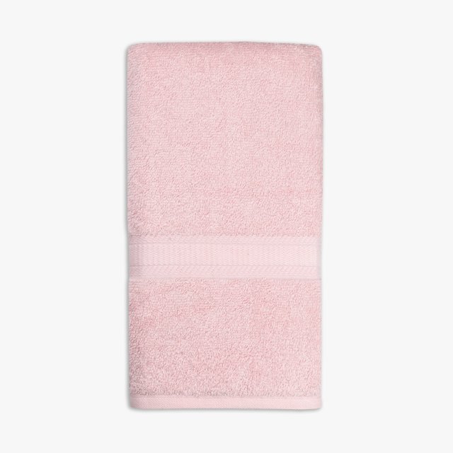 Light pink Mainstays Basics solid hand towel folded with a textured decorative band.