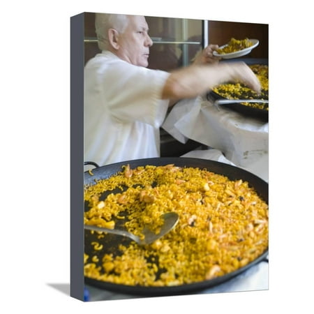 Man Serving Paella, with Noodle Paella in Foreground, Central, Valencia, Spain Stretched Canvas Print Wall Art By Greg
