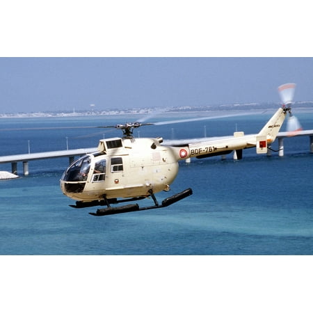 The Door Stop LAMINATED POSTER A BO-105 helicopter of Bahrain flies inland near a causeway in the aftermath of Operation Desert Sto Poster Print 24 x 36 ()