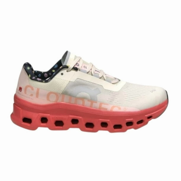 Tenis On Cloud Cloudmonster para mujer color blanco con suela de goma rosa fuerte y agujetas.