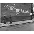 thumbnail image 2 of U.S. Ninth Army Signalmen Repair Wires Near German Graffiti In The Netherlands. It Reads History, 2 of 2