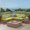 Teak/Green/Light Gray, variant on GDF Studio Biella Outdoor Acacia Wood 5 Seater Sectional Sofa Set with Fire Pit, Teak, Cream, and Light Gray