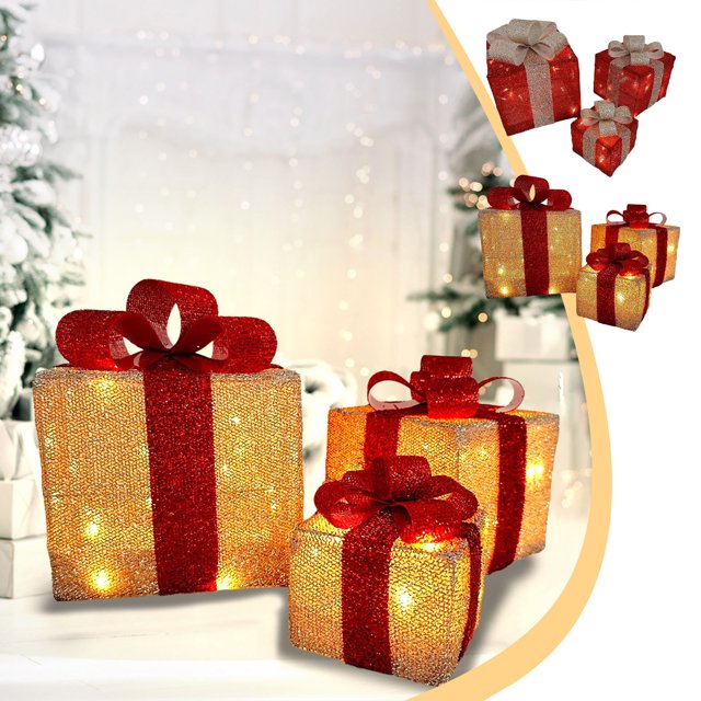 xihbxyly cajas de luz navideñas juego de 3 piezas rojo, vista 3/4 frontal de tres cajas de regalo plegables de hierro con lazo superior, malla brillante roja y luces LED cálidas visibles, sobre superficie blanca con árbol de Navidad desenfocado; también aptas como decoración festiva multiusos para bodas y oficinas.