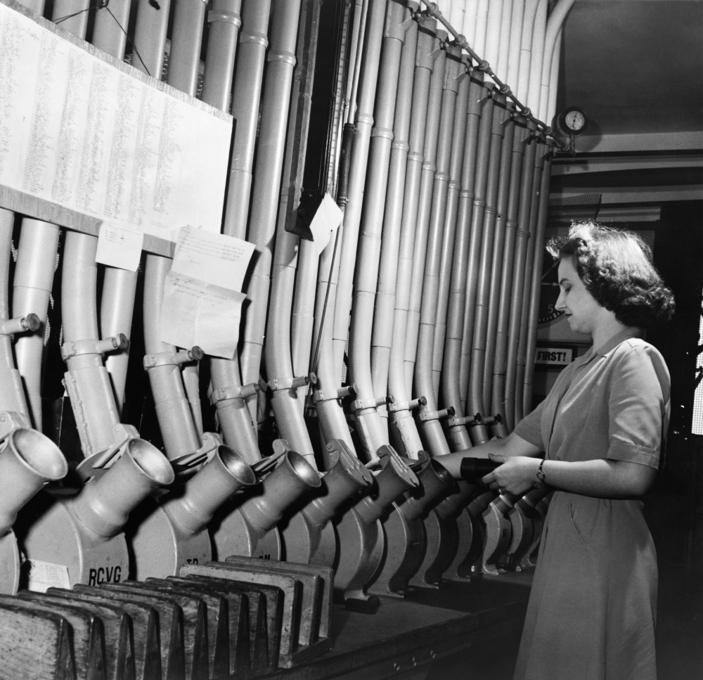 Pneumatic Tubes, 1943. /Na Woman Delivers Messages To Different