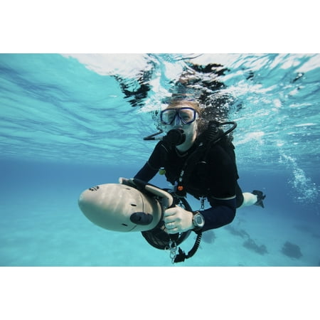 Terry Madden Art - Scuba diver navigates the waters using a diver propulsion vehicle Canvas Art - Terry MooreStocktrek Images (35 x 23)