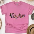 thumbnail image 1 of Nurse Graphic T-Shirt with String Lights Design, Unisex Casual Tee, Heliconia, Size L, 1 of 6