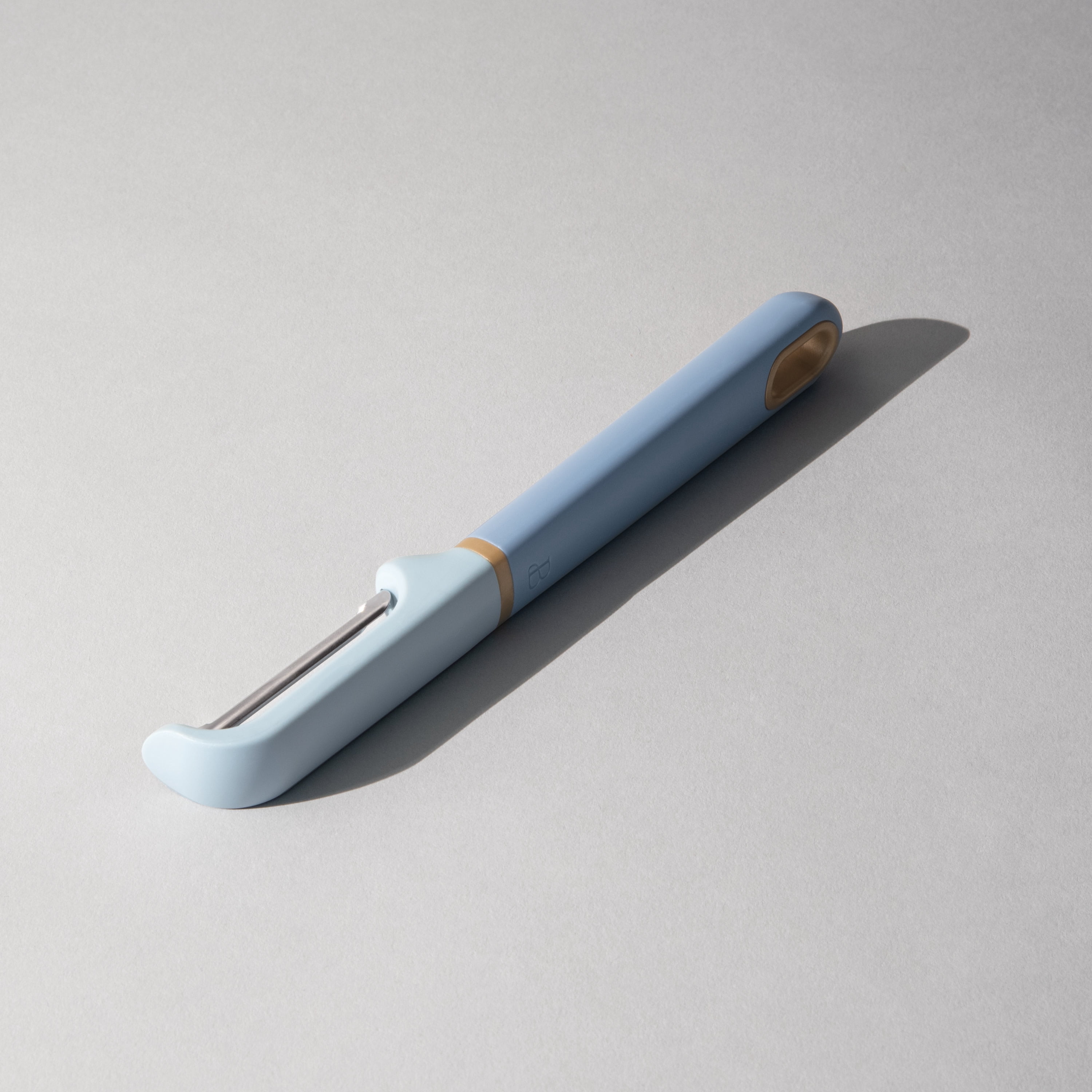 Beautiful Swivel Peeler with Stainless Steel Blade in Blue Icing by Drew Barrymore