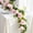 Pink, variant on Lewondr Artificial Eucalyptus Garland, 2 Pack 6FT Floral Garland with 8 Roses 8 Peonies Eucalyptus Leaves, Maintenance-Free Greenery Backdrop for Wedding Table Backdrop Centerpiece, Mixed Champagne