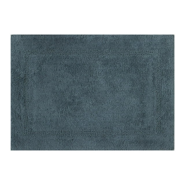 Nimbus blue reversible cotton bath rug with a subtle textured border, sized 17 by 24 inches.