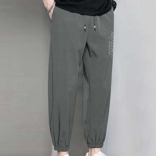 Pantalones casuales de moda para hombre, con bolsillos y tobillos, color liso, cintura elástica y cordón ajustable.