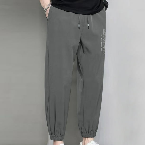 Pantalones casuales de moda para hombre, con bolsillos y tobillos, color liso, cintura elástica y cordón ajustable.