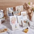 thumbnail image 4 of Exhibidor de tarjetas de felicitación de acrílico de 6 niveles, portátil, organizador de pegatinas, sellos, postales y tarjetas de felicitación navideñas., 4 of 5