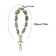 thumbnail image 2 of Llavero bohemio de flores tejidas a mano con colores contrastantes, pulsera y colgante para telfono., 2 of 7