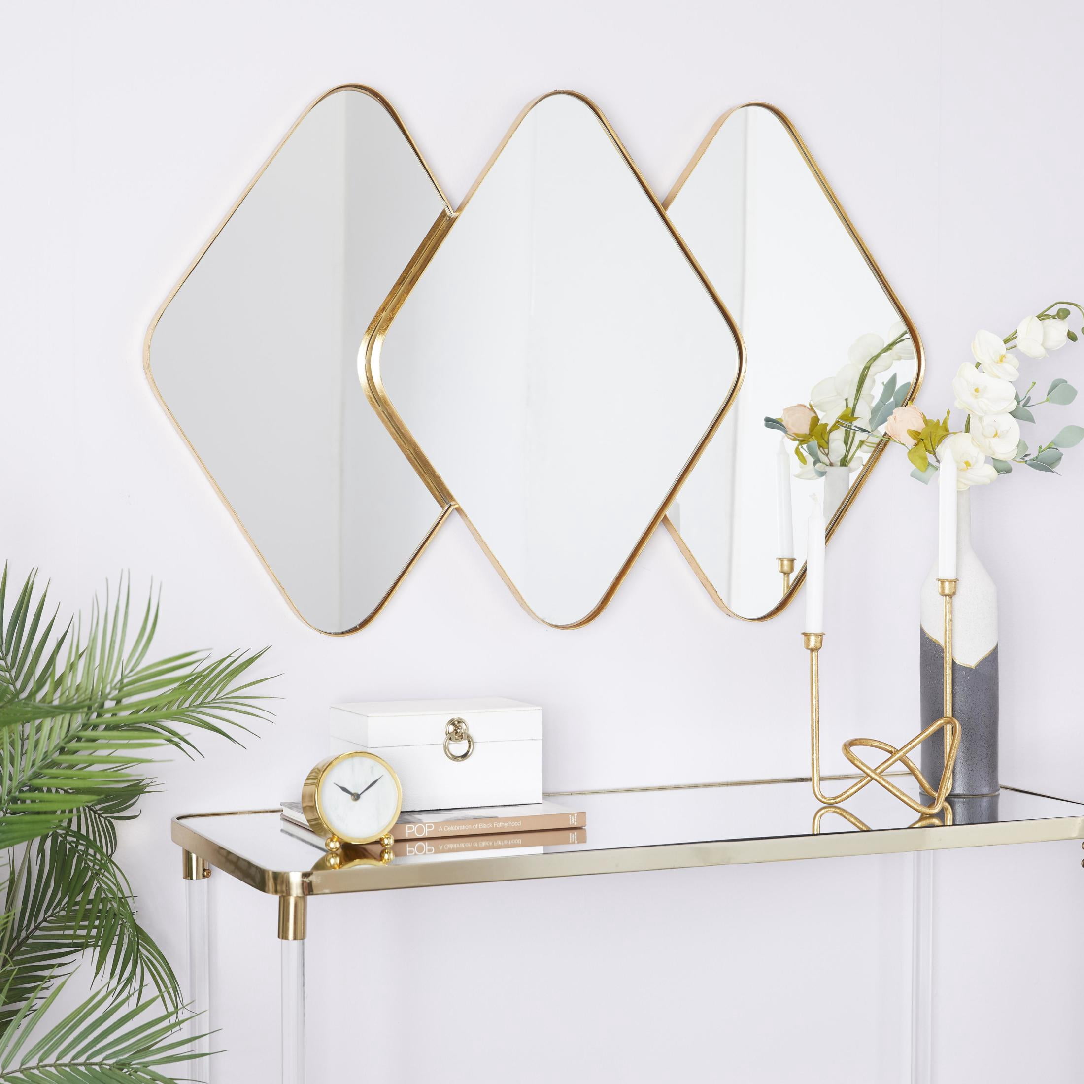 CosmoLiving by Cosmopolitan 43" x 28" Gold Overlapping Diamond Wall Mirror with Gold Frame