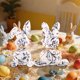 thumbnail image 4 of Figurita de conejo de Pascua de estilo porcelana azul y blanca adorno de conejo • Decoración navideña para mesa central • Decoración duradera para fiestas de Pascua, 4 of 6