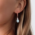 thumbnail image 3 of Gem Stone King 18K Rose Gold Plated Silver Sky Blue Topaz and White Lab Grown Diamond Dangle Earrings for Women (4.57 Cttw, Oval 9X7MM), 3 of 3