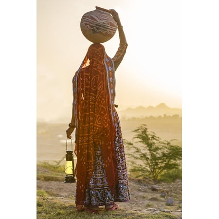 Art.com Ahir Woman in traditional colorful cloth carrying water, India Photographic Print by G&M Therin-Weise, 16" x 24"