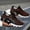 Orange Yellow, variant on Lightweight Breathable Sneakers for Men Featuring a Geometric Black And White Design, Ideal for Running, Walking, And Training. They Come with a Lace-Up Closure, MD Sole, And Fabric Upper