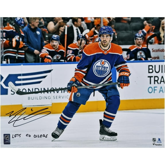 Evan Bouchard Edmonton Oilers Autographed 16" x 20" Royal Jersey Skating Photograph with "Lets Go Oilers!" Inscription - Fanatics Authentic Certified